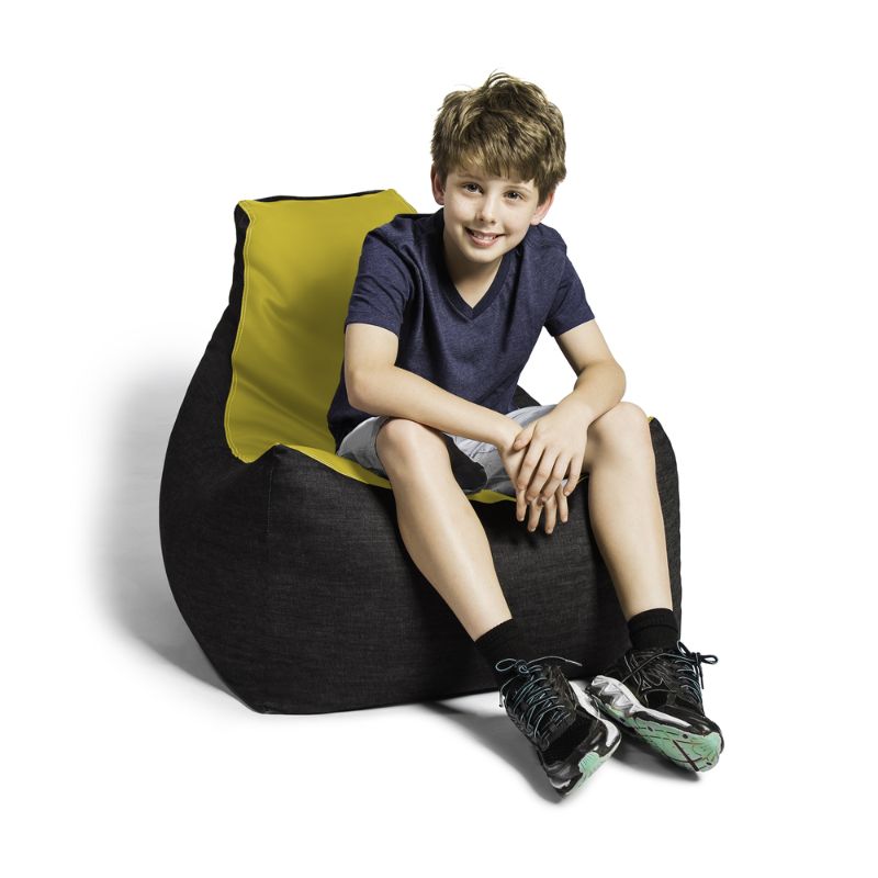 A boy sits comfortably in the Jaxx Pixel gaming bean bag chair in yellow, a colourful gaming seat for kids