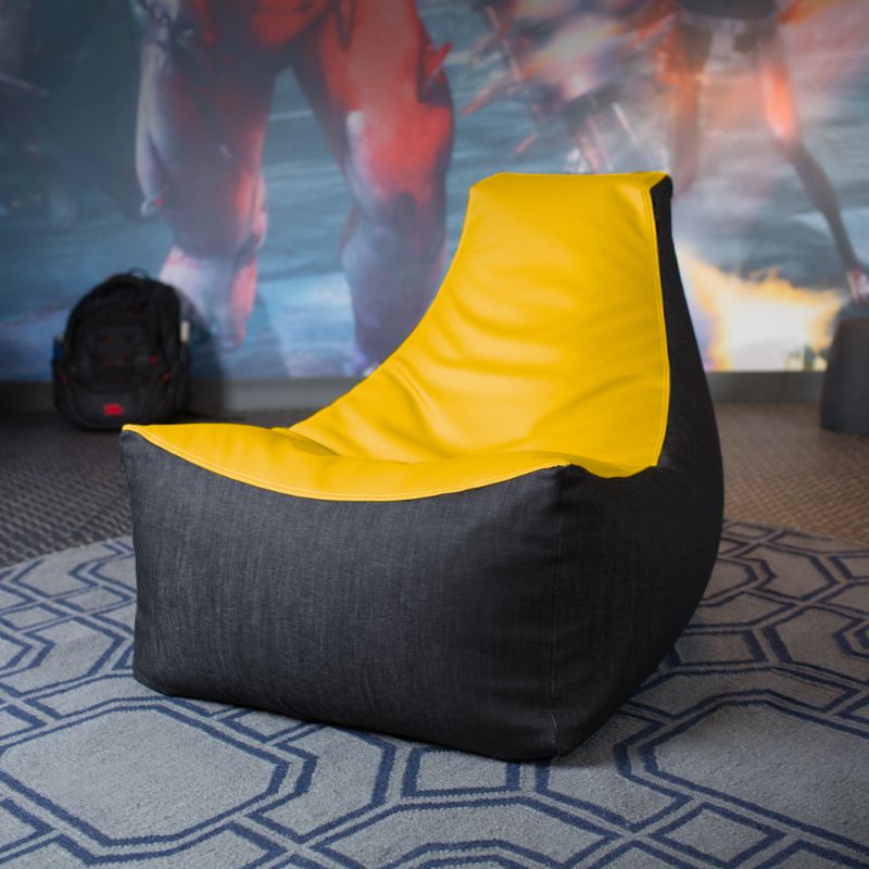 The Jaxx Pixel gaming bean bag chair in yellow sits in a game room, a colourful seat for kids