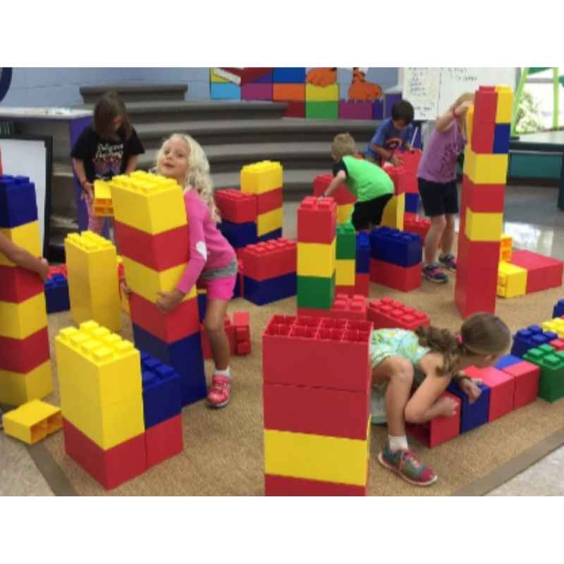 Children building red, yellow and blue block towers with the EverBlock Classroom Play Mixed Block Set in a school classroom