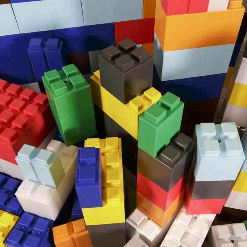  Close-up of stacked EverBlock giant building blocks in assorted colours, a modular block set for classroom building
