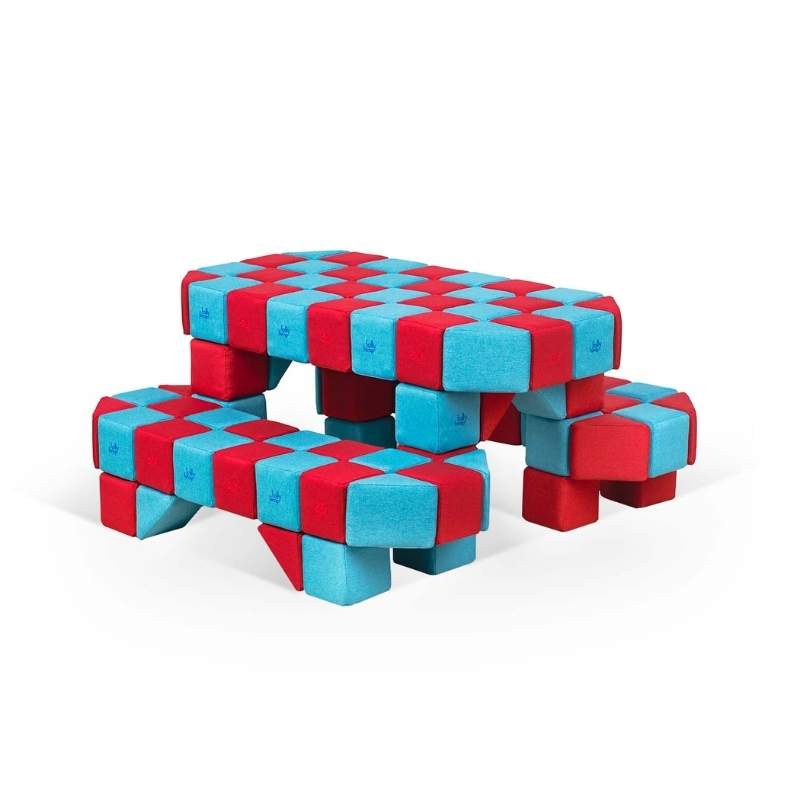 Close up view of a picnic table built from JollyHeap Joy giant magnetic building blocks in red and light blue for a classroom or play corner