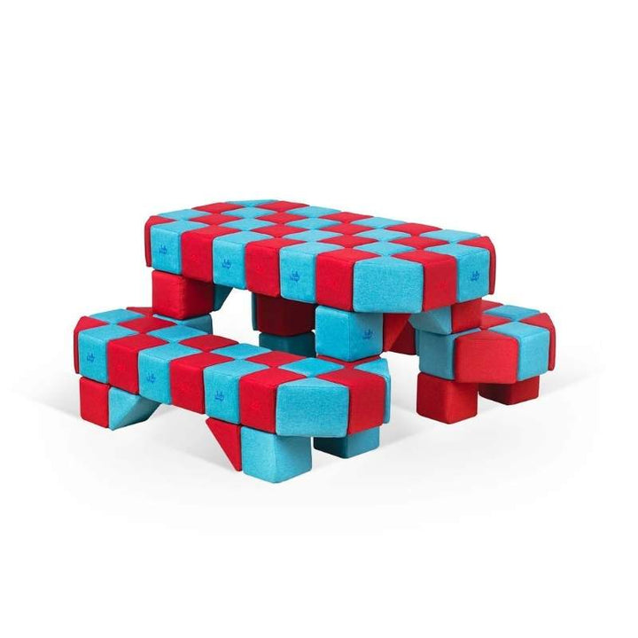Close up view of a picnic table built from JollyHeap Joy giant magnetic building blocks in red and light blue for a classroom or play corner