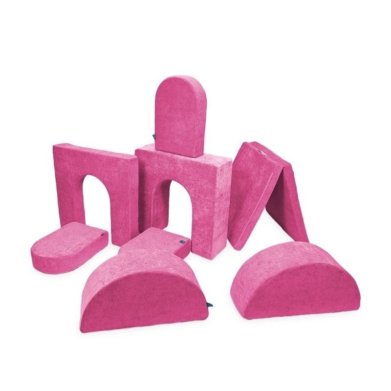 Go Coconut Architect Bundle in Pitaya Punch showing the modular foam play couch with half-moon rockers, walls, doors, and thin base pieces made in Canada with CertiPUR-US certified foam