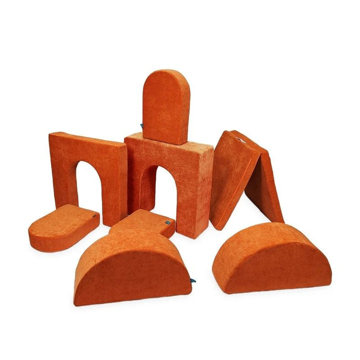 Go Coconut Architect Bundle in Twisty Tangerine showing the 8-piece CertiPUR foam play couch with machine-washable Durable Micro Velveteen covers and half-moon rocker pieces, 100% made in Canada