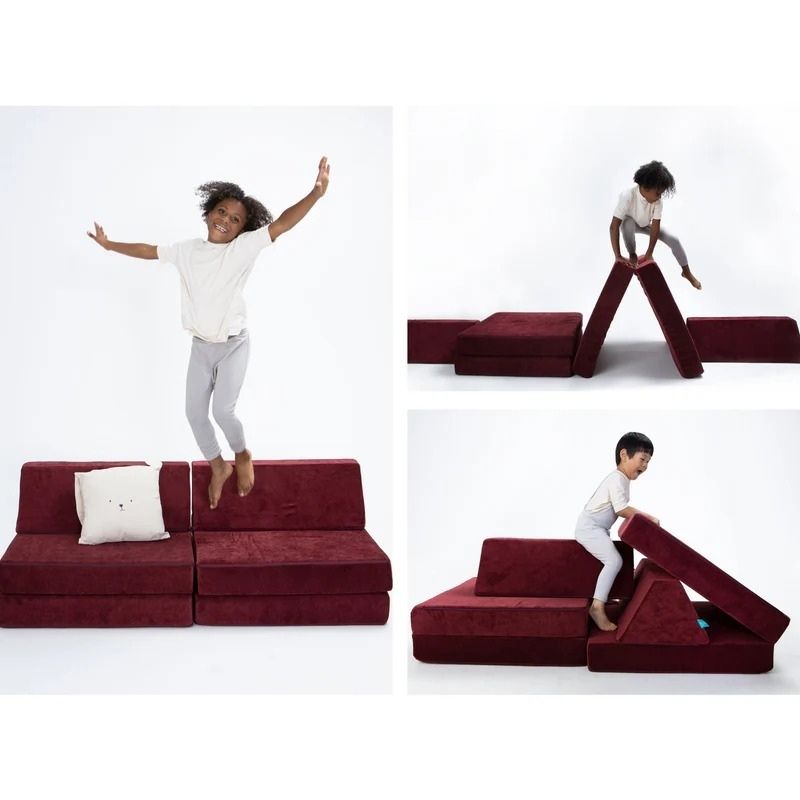Children actively playing on Go Coconut - The Coconut in Cranberry Rain showing the open-ended modular foam configurations of the Montessori-inspired Canadian play couch