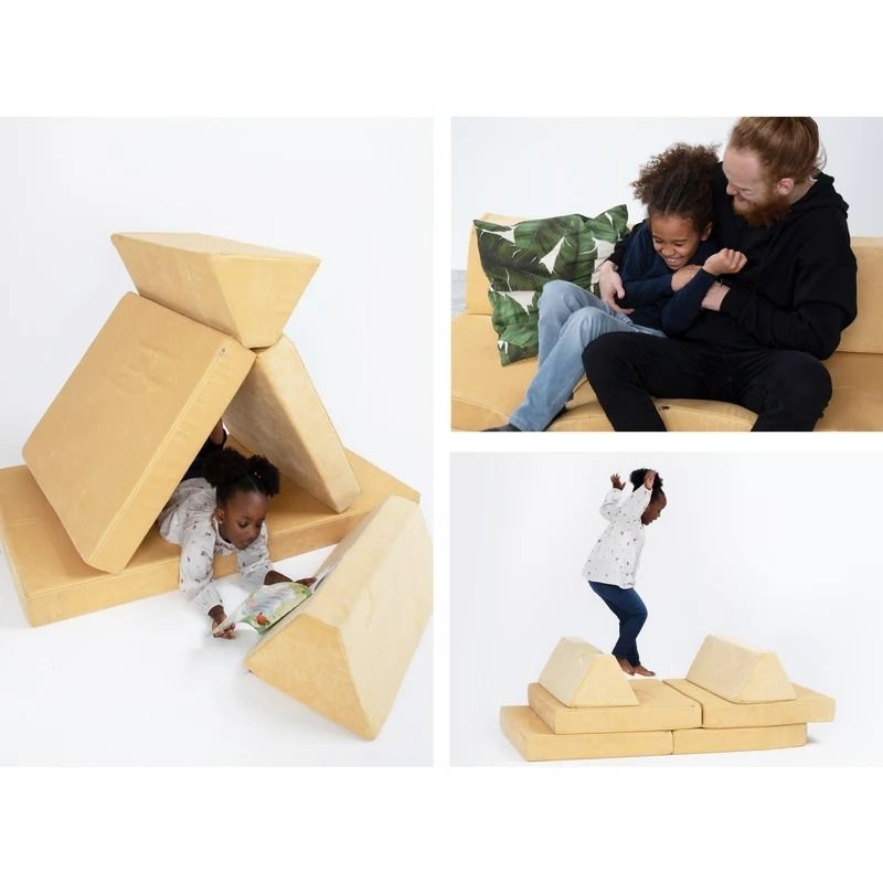 Children playing on Go Coconut - The Coconut in Light Yellow demonstrating the open-ended creative and sensory play possibilities of the Montessori-inspired Canadian-made modular play couch