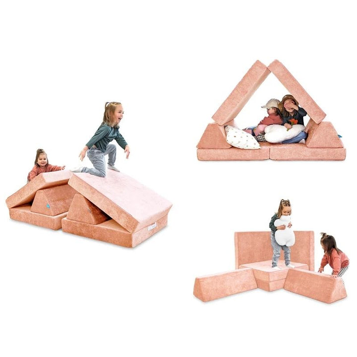 Children playing and building on Go Coconut - The Coconut in Peach Party showing the open-ended Montessori-inspired foam configurations of the 100% Canadian-made CertiPUR play couch