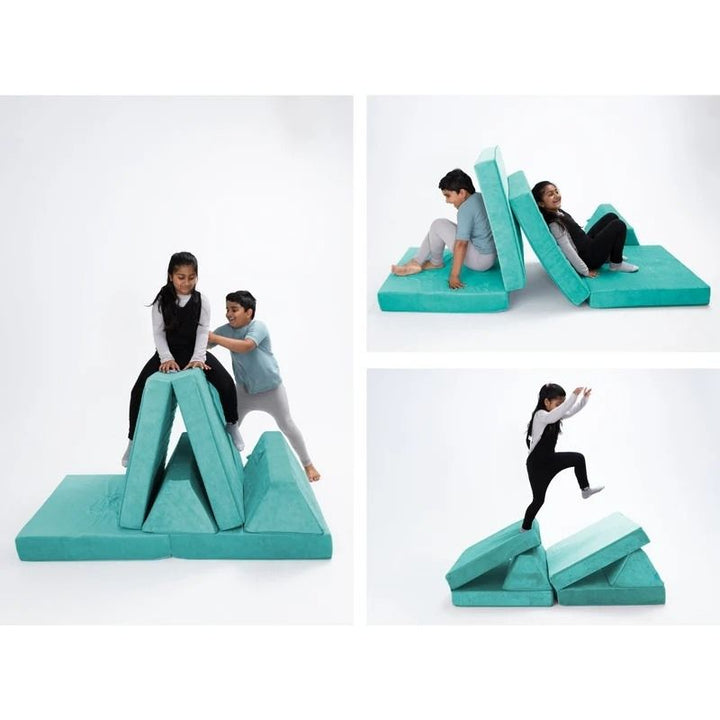 Children playing on Go Coconut - The Coconut modular play couch in Tropical Teal showing the open-ended foam configuration possibilities and creative play value of the Montessori-inspired design