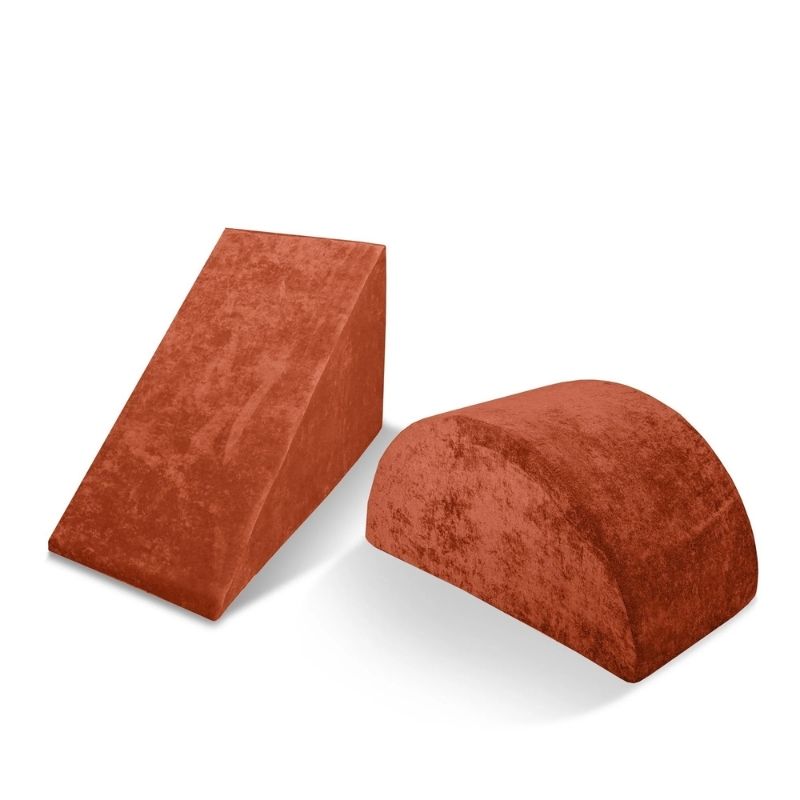 Go Coconut Wedge & Mega Rocker Bundle in Terracotta Twirl showing the triangular foam Wedge slide ramp and curved arch Mega Rocker for active balance and movement play with Go Coconut modules
