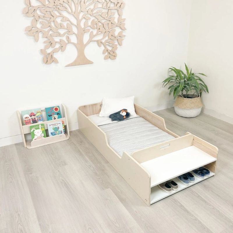 Sapiens Child Guava Montessori Bookshelf landscape top view showing the angled forward-facing book slots and overall compact design of the Canadian-made Montessori toddler bookshelf
