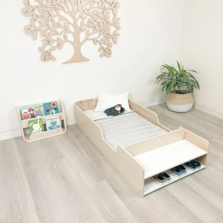 Sapiens Child Guava Montessori Bookshelf landscape top view showing the angled forward-facing book slots and overall compact design of the Canadian-made Montessori toddler bookshelf