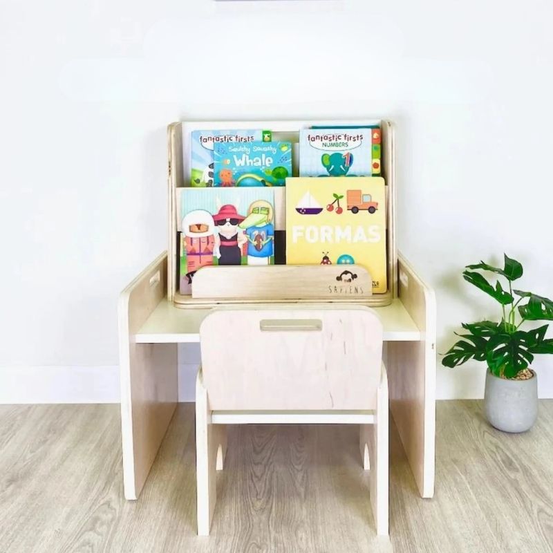 Sapiens Child Guava Montessori Bookshelf paired with a child-sized chair in a reading nook setting, showing how the forward-facing bookshelf creates an inviting independent reading space for toddlers