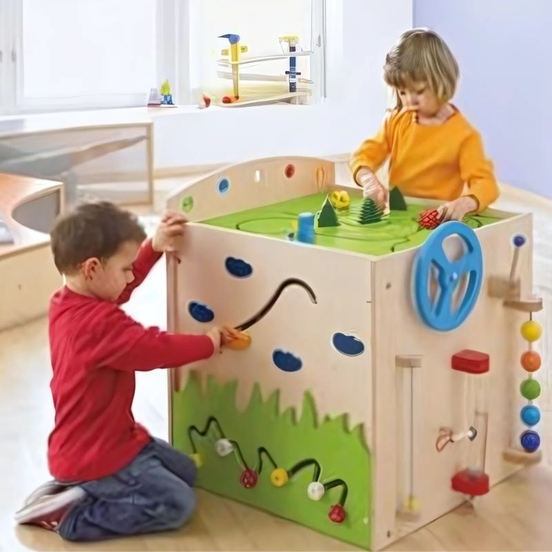 HABA Pro Multi Learning Cube driver's station panel with spring spheres and magnetic discovery tube - fine motor and hand-eye coordination play for toddlers and children