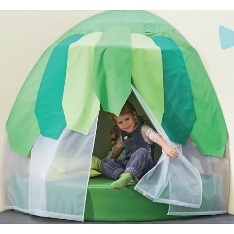 HABA Pro Grow.upp Canopy Retreat Cave in active use, showing a child inside the birch wood sensory play cave with leaf canopy