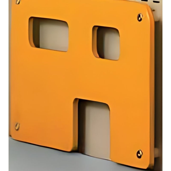 Close-up of the HABA Pro City Wall orange house-shaped birch wood application, showing the cut-out window details and wall-mount hardware included with the climbing panels