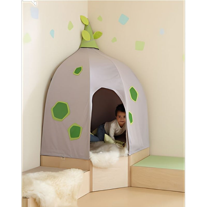 HABA Pro Grow.upp Corner Cave Cover installed in a room corner with a child engaged in sensory play inside