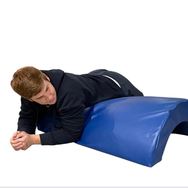 Side view of the TFH Half Barrel Rocker, a vinyl vestibular rocker demonstrating its full curved length for rocking and climbing play