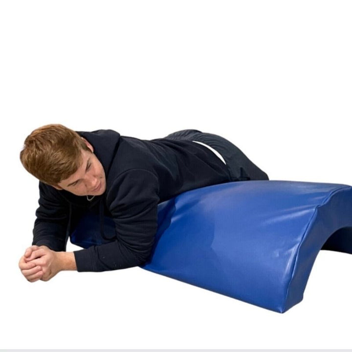 Side view of the TFH Half Barrel Rocker, a vinyl vestibular rocker demonstrating its full curved length for rocking and climbing play