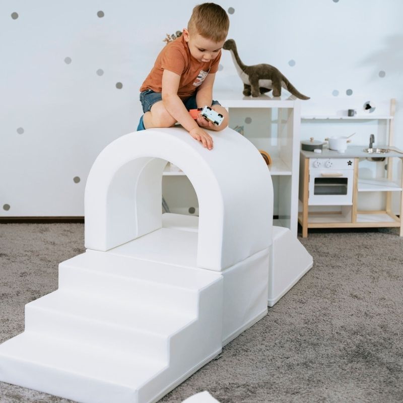Close-up of IGLU Imagination Tunnel foam shapes showing eco-leather cover texture and rounded safe edges for toddler soft play