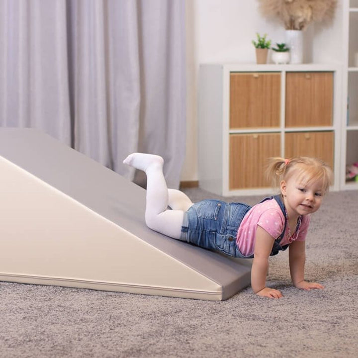 Child sliding down the IGLU Soft Play Mega Fun Slider foam set in Beige/Grey colourway