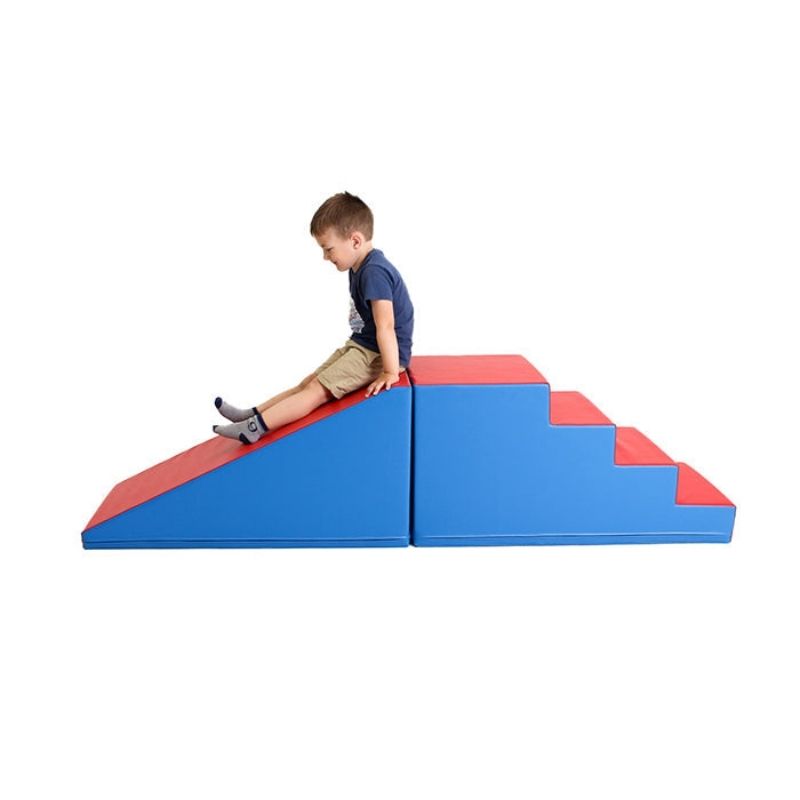 IGLU Soft Play Mega Fun Slider side view with child climbing foam steps, demonstrating indoor soft play equipment for toddlers