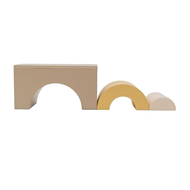 The three individual foam pieces of the IGLU Rainbow Bridge Soft Play Set in Beige/Honey laid out separately - large beige bridge arch, medium yellow arch, and small cream half-dome