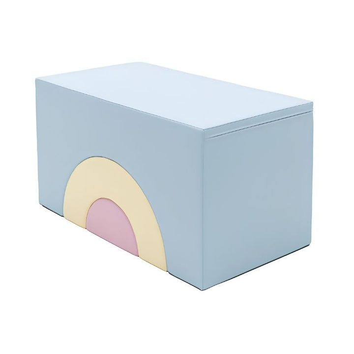 Angled three-quarter view of the IGLU Rainbow Bridge Soft Play Set in Pastel Ice Cream, showing the top surface and arched front face of the stacked foam climbing set