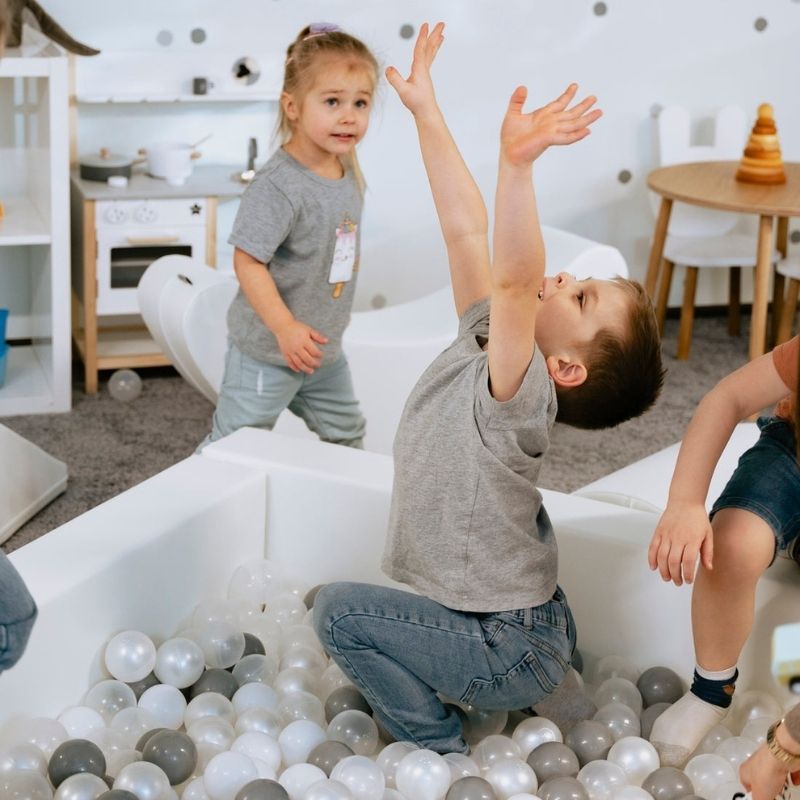 Children playing in the IGLU Soft Play ball pit, part of the Soft Play Party Set foam indoor play equipment set