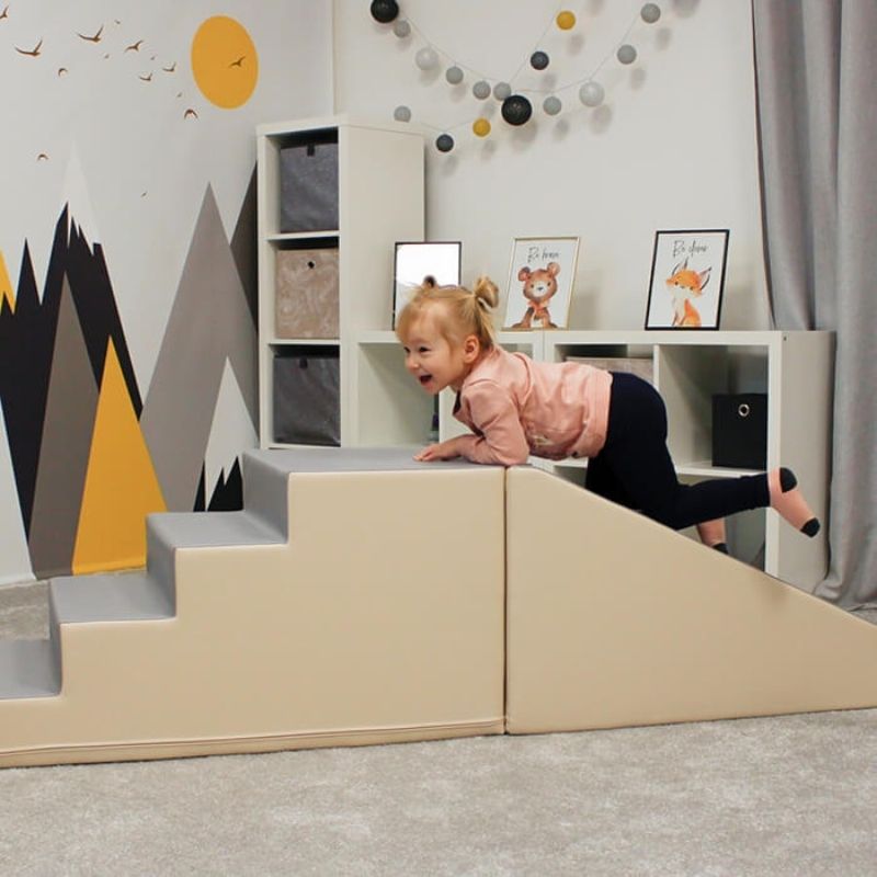 Child playing on IGLU Soft Play Mega Fun Slider in Beige/Grey, showing foam step and slide for gross motor skill development