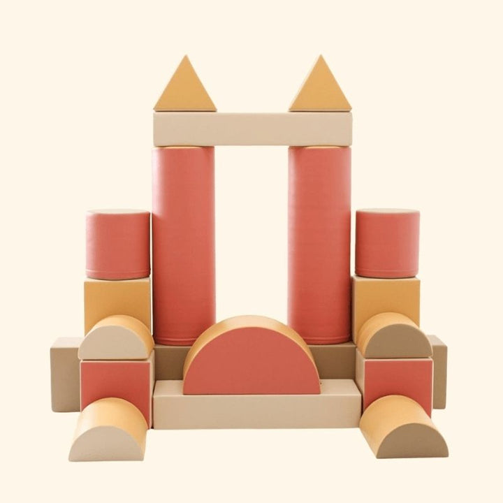Clean product image of the IGLU Soft Play Fortress foam blocks in pastel pink, showing the eco-leather surface and overall set quality