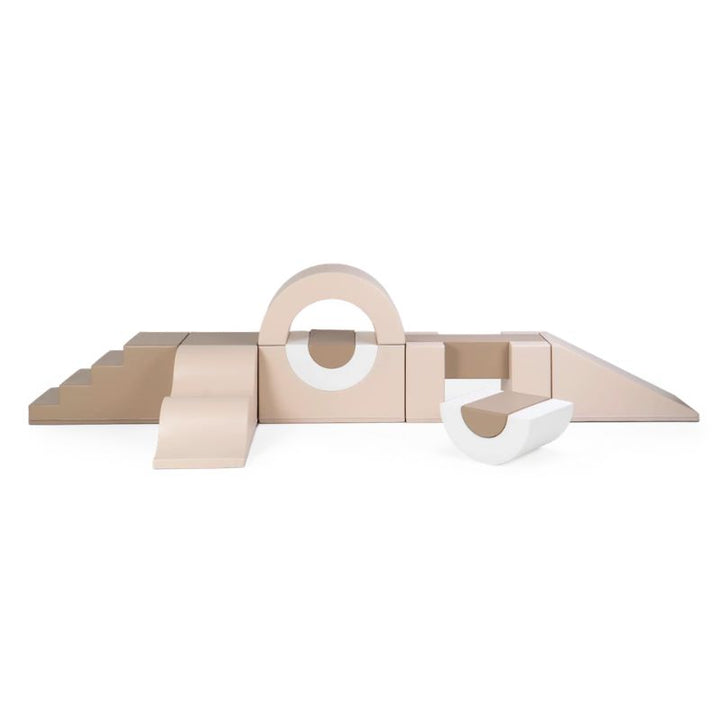 IGLU Soft Play Gym in the Soft Serve colourway, a neutral-toned modular sensory gym with stairs, an arch tunnel and a ramp