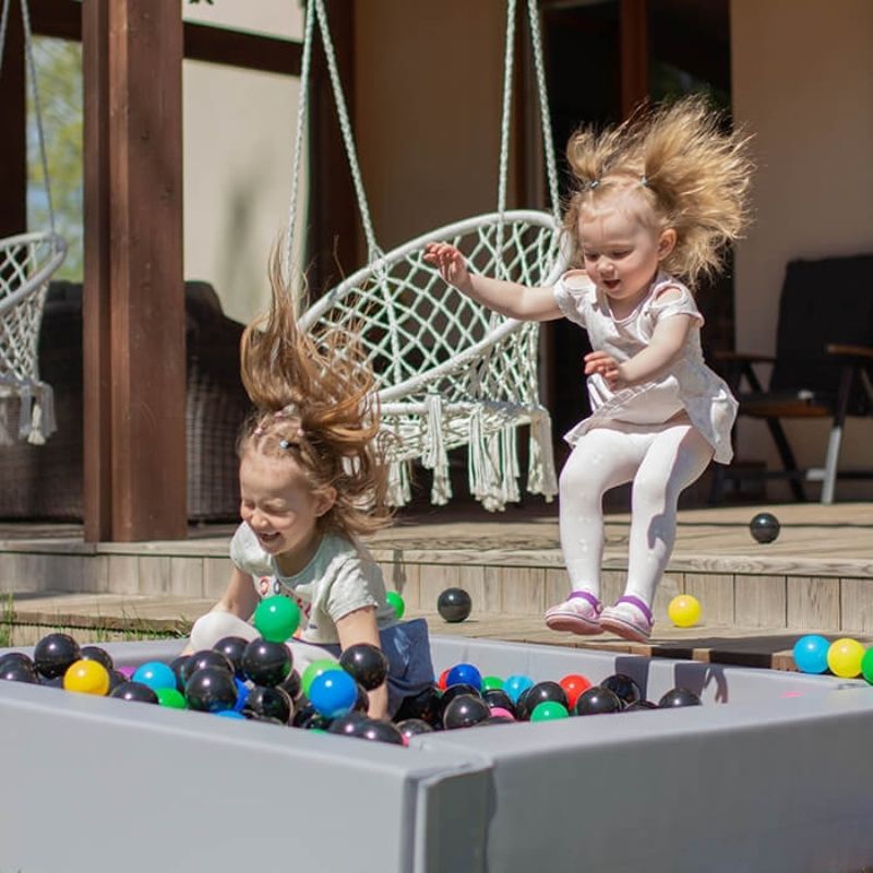 Two children playing in IGLU Soft Play Square Ball Pit in white, showing the spacious 51-inch foam ball pit for group play
