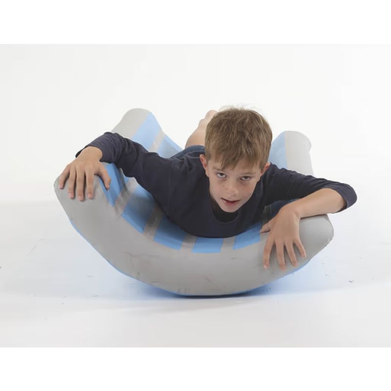 TFH Inflatable Body Rocker in blue and grey stripes, a vestibular sensory toy with a child rocking face-down for balance and motor planning