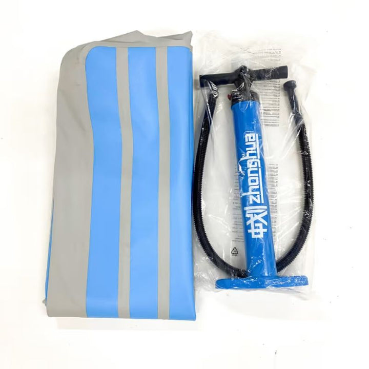 TFH Inflatable Body Rocker deflated and folded next to its foot pump and accessories, showing the complete sensory toy package