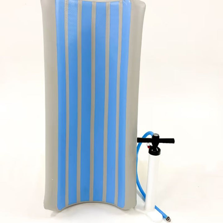 TFH Inflatable Body Rocker shown upright beside its included foot pump, ready to inflate for vestibular sensory play
