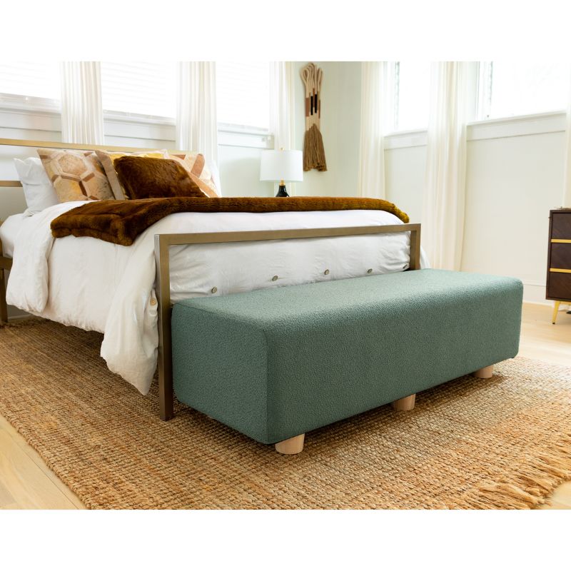 Jaxx Caya Boucle Bed Bench in green styled at the foot of a bed, a flexible seating bench for bedrooms