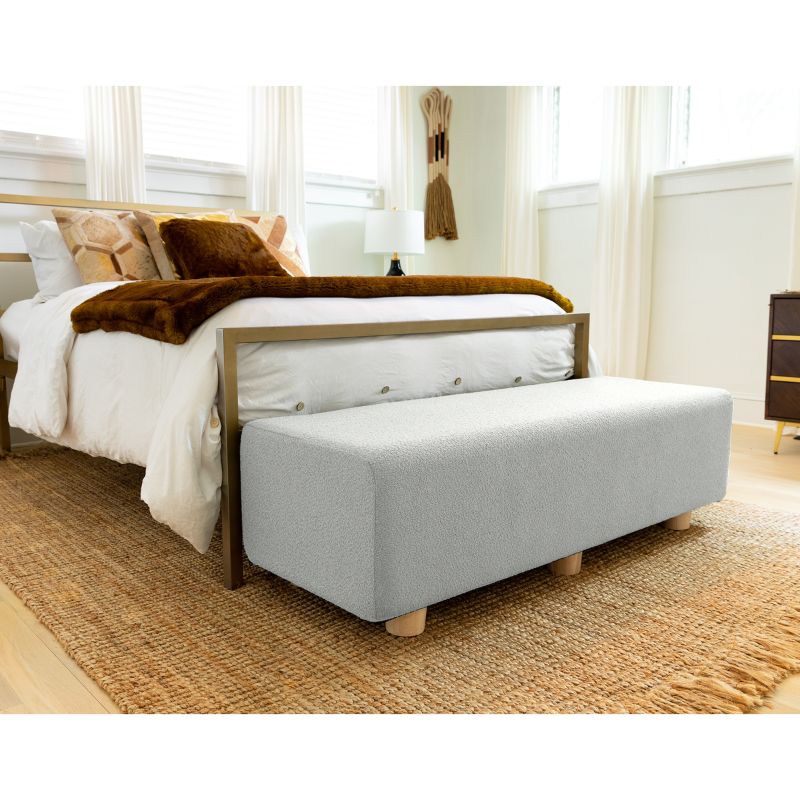 Jaxx Caya Boucle Bed Bench in silver styled at the foot of a bed, an end of bed bench for home seating