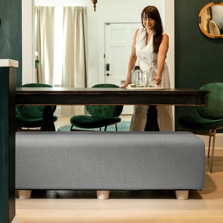 Jaxx Caya Bed Bench in dark grey boucle used as dining table seating, a flexible bench for home and dining spaces