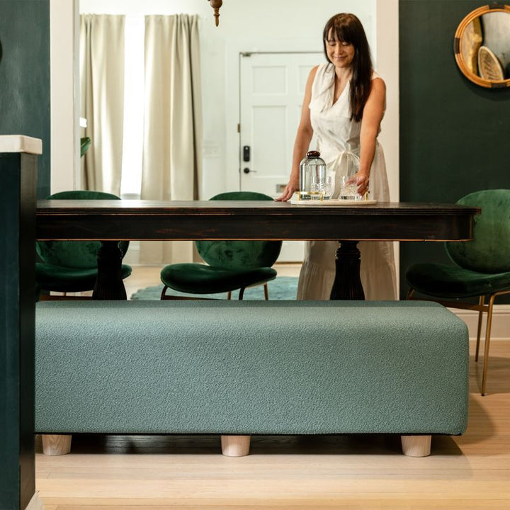 Jaxx Caya Bed Bench in green boucle used as dining table seating, a flexible bench for home and dining spaces