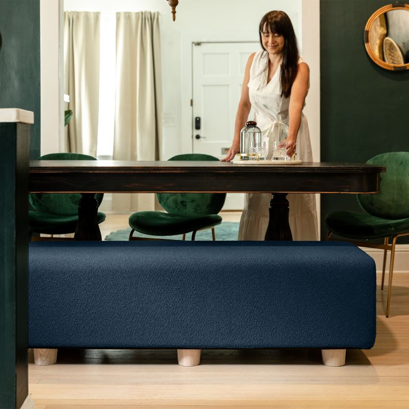 Jaxx Caya Bed Bench in navy boucle used as dining table seating, a flexible bench for home and dining spaces