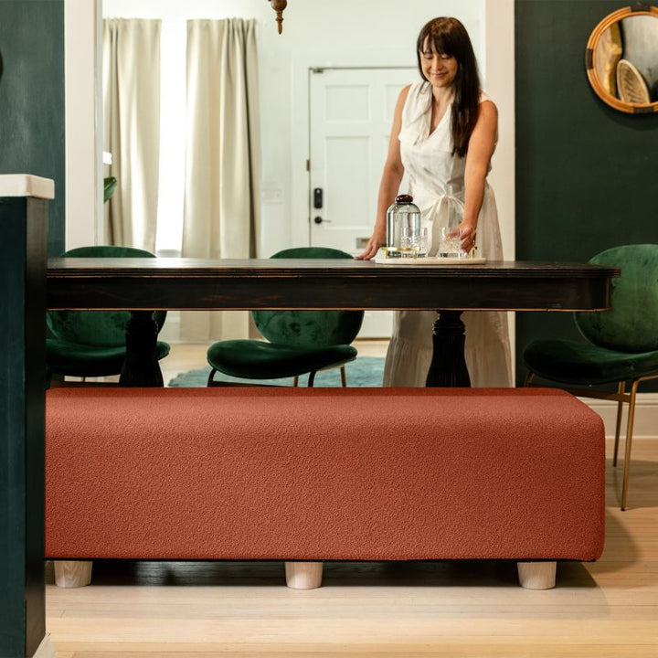 Jaxx Caya Bed Bench in terra cotta boucle used as dining table seating, a flexible bench for home and dining spaces