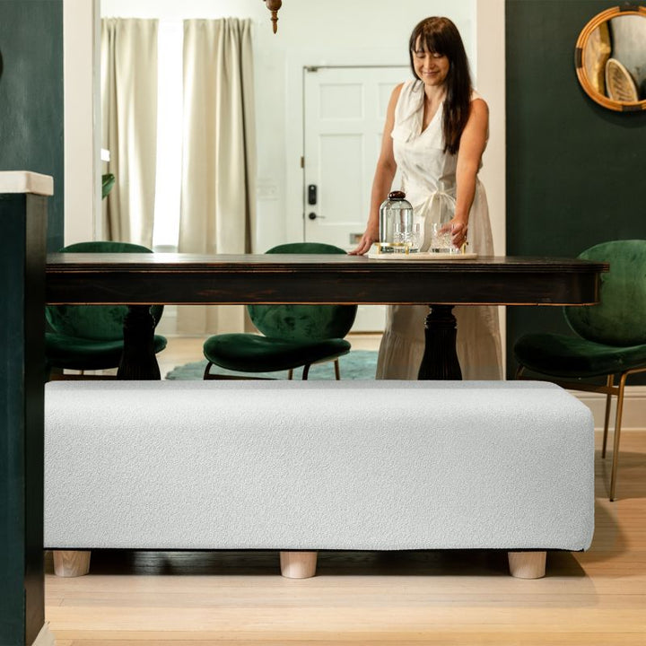 Jaxx Caya Bed Bench in white boucle used as dining table seating, a flexible bench for home and dining spaces