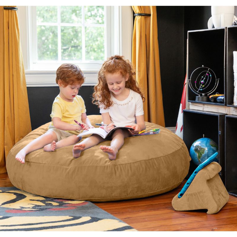 Two children reading together on a camel Jaxx Cocoon 4ft kids bean bag chair, a cozy deep pressure crash pad