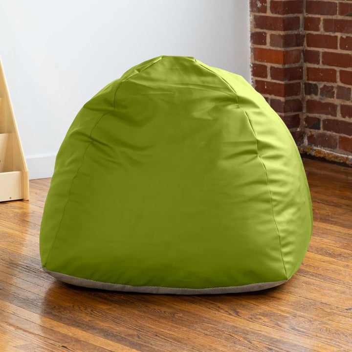 Empty green Jaxx Gumdrop bean bag chair in a classroom reading corner
