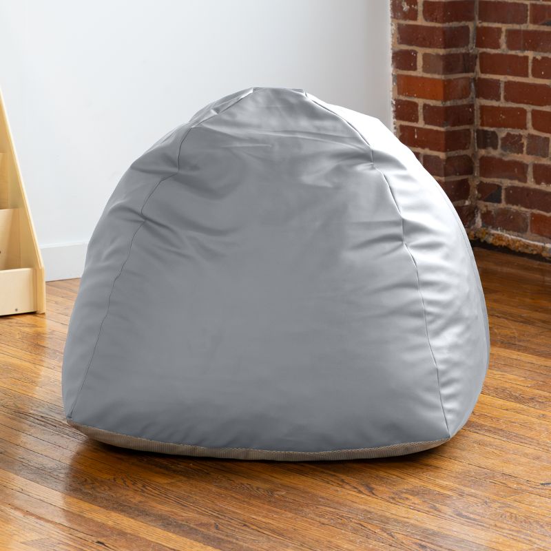Empty grey Jaxx Gumdrop bean bag chair in a classroom reading corner