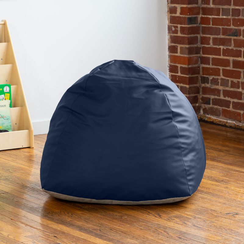 Empty navy Jaxx Gumdrop bean bag chair in a classroom reading corner
