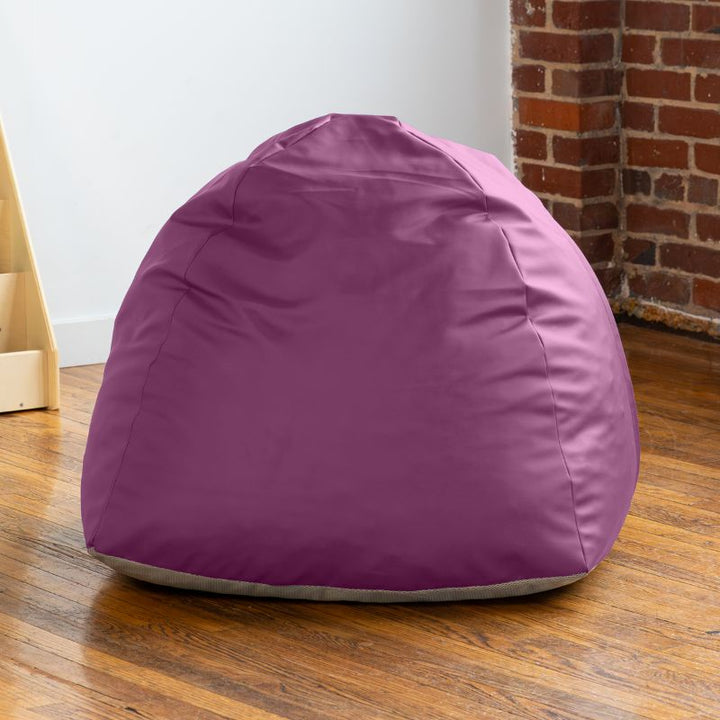Empty purple Jaxx Gumdrop bean bag chair in a classroom reading corner