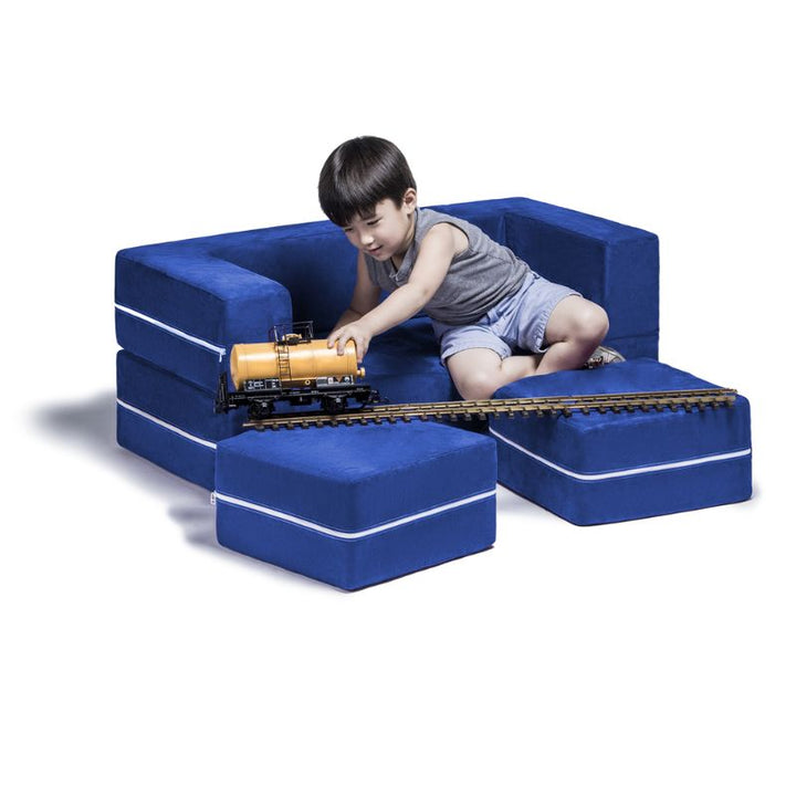 Jaxx Zipline kids convertible loveseat in blue microsuede in use as seating, a modular play sofa with matching ottomans