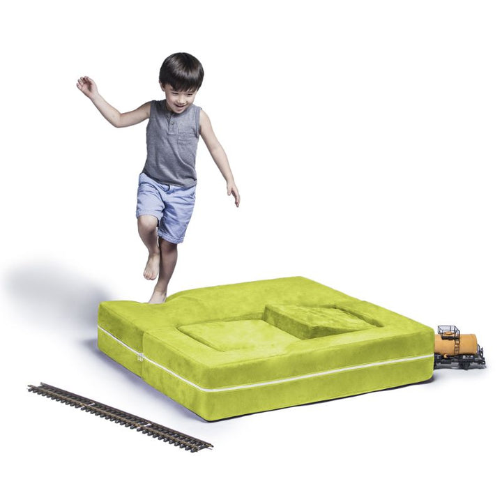 Jaxx Zipline kids convertible loveseat in green microsuede in bed mode, a 3-in-1 play sofa for active play and naps