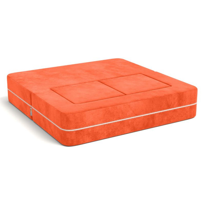 Jaxx Zipline kids convertible loveseat in orange microsuede folded into bed mode, a modular play sofa that converts to a bed